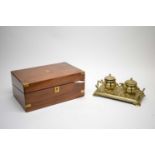 A Victorian brass ink stand; and a rosewood writing slope.