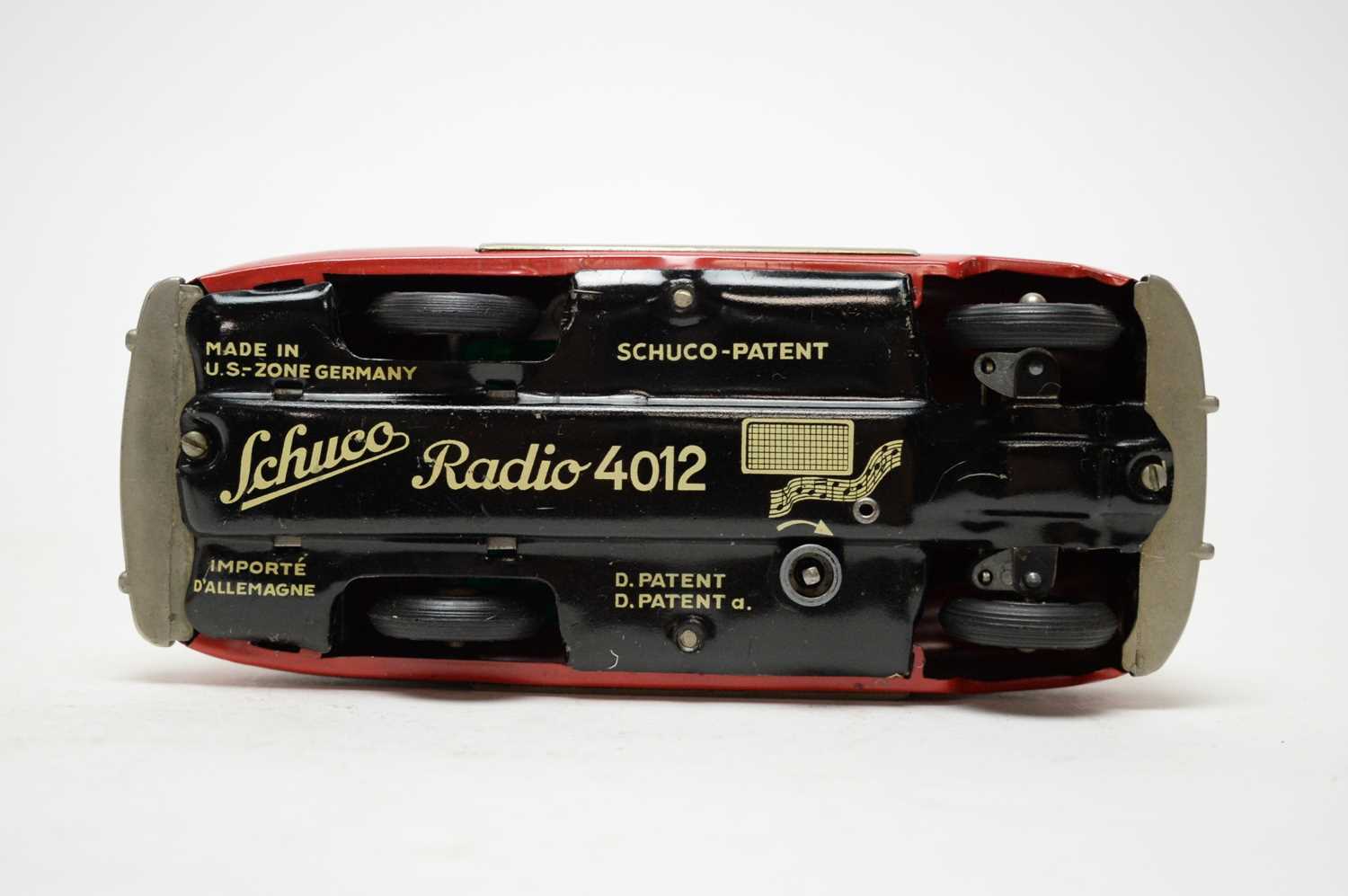 A Schuco Radio 4012, formed as a musical red tin plate clockwork car. - Image 3 of 3