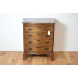 A 1930s Georgian-style serpentine chest of drawers