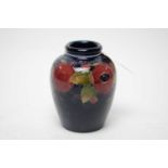 A Moorcroft ‘Pomegranate’ pattern vase.