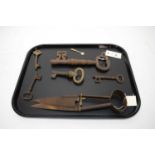 A collection of vintage iron keys of various sizes; and a set of shears.