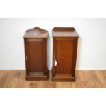 20th Century mahogany bedside cabinets, erased gallery back over single dog cabinets.