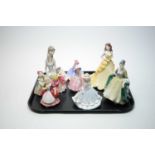 A selection of Royal Doulton decorative ceramic figures of ladies