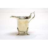 A silver cream jug, by Walker & Hall,