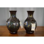 A pair of Chinese enamelled bronzed vases, with twin ring handles.