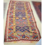 A 20th Century Kazak Islamic runner rug