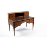 Heal & Son, London: a late Victorian inlaid writing desk.