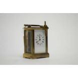 A French brass cased carriage clock, with Roman dial.