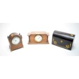 An Edwardian mantle clock; together with another mantle clock; and a Victorian coromandel tea caddy