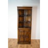 An 20th Century oak corner cupboard