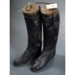 A pair of black leather hunting boots, each with boot tree to interior.