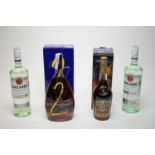 A bottle of Millenium Courvoisier Le Cognac de Napoleon Cognac; and others