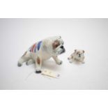 Two Carlton Ware figures of bulldogs, each with Union Jack decoration to back.