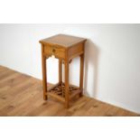 A 20th Century Chinese oriental hardwood pedestal table.