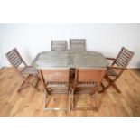 A Rawlinson Garden Products teak garden table and 8 chairs
