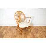 Ercol, Model 252: a retro vintage circa 1960's beech and elm fireside Windsor chair