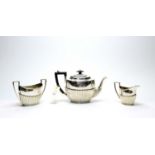 A three-piece silver tea service, by James Deakin & Sons