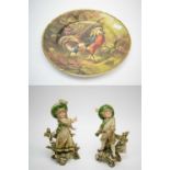 A French Limoges cabinet plate, and a pair of Austrian Royal Vienna style bisque figures