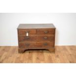 An 18th Century oak chest of drawers of low form.