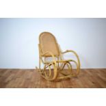 A retro vintage mid 20th Century bamboo rocking chair