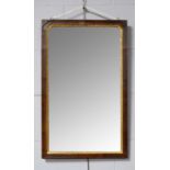 A 20th Century mahogany framed wall hanging mirror of rectangular form