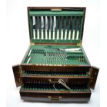 A 19th Century mahogany canteen of cutlery, containing a part suite of Alpha Plate cutlery.