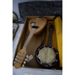 A mid-Century mandolin, with inlaid floral decoration; together with a banjolele, in carry case.
