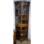 A 20th Century mahogany floor standing glazed corner cupboard