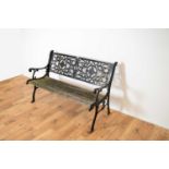 A 20th Century ebonised cast metal garden bench.