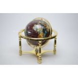 A specimen stone table globe, on gilt metal stand with compass undertier