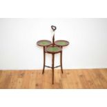 A 20th Century three sectioned mahogany occasional table