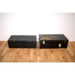 Two 20th Century ebonised metal travelling trunks of rectangular form