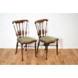 A pair of early 20th Century mahogany bedroom chairs