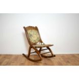 A 20th Century mahogany folding rocking chair