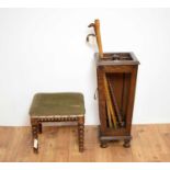 An early 20th Century oak stick stand, with sticks and stool