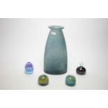 Three Mdina glass paperweights and another paperweight; and an opaque mottled blue glass vase