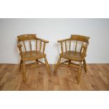 A pair of contemporary beech and elm captain's chairs/smokers bow dining carver chairs.