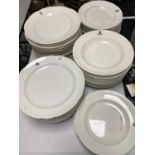 A selection of crested dinner wares, comprising dinner and side plates
