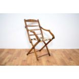 A late 19th Century/early 20th Century inlaid mahogany folding campaign chair