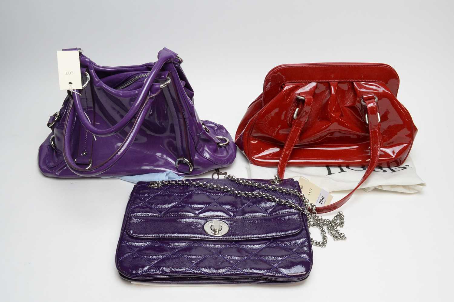 A Lulu Guinness quilted purple leather shoulder bag; and two others