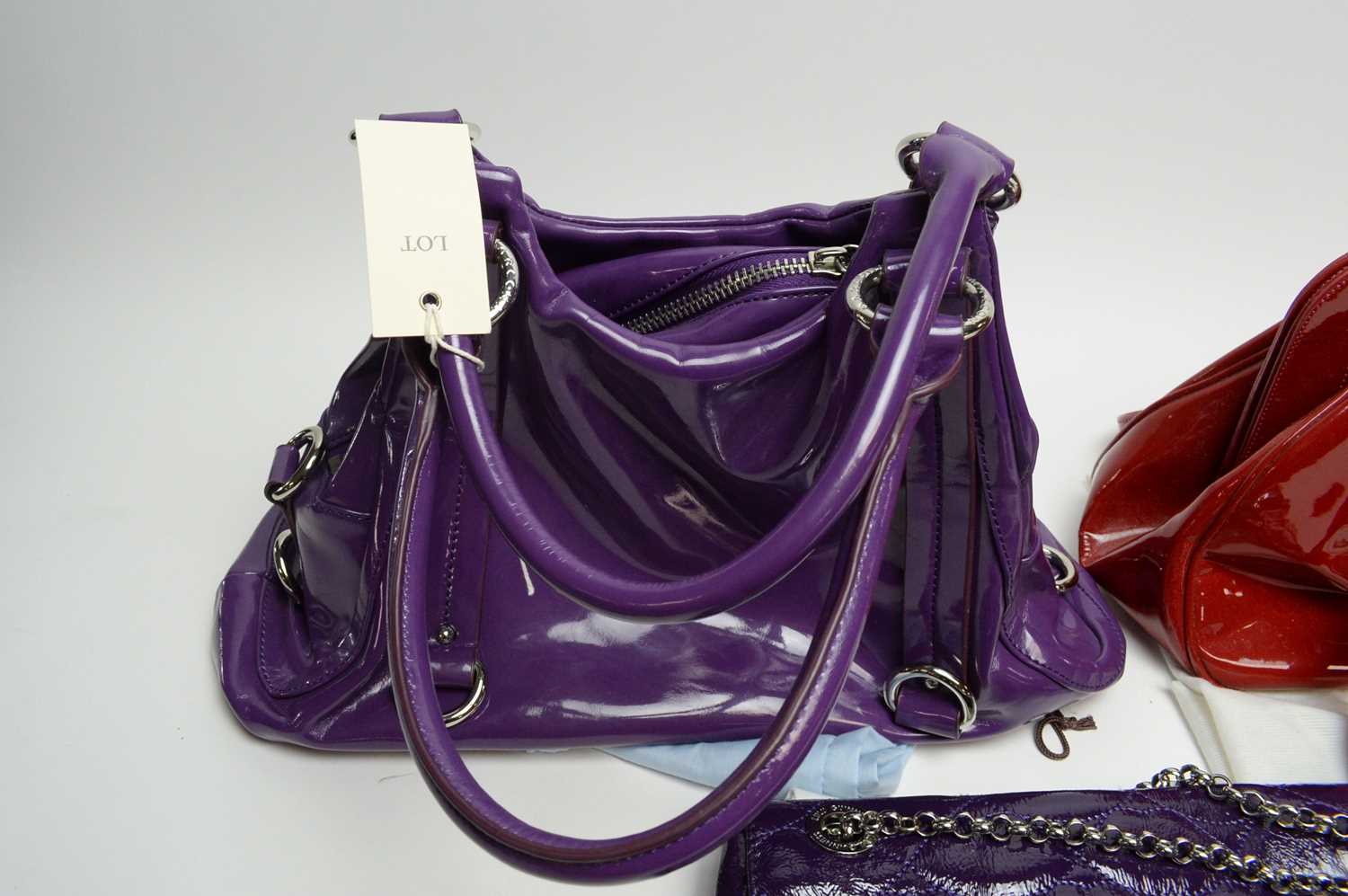 A Lulu Guinness quilted purple leather shoulder bag; and two others - Image 4 of 4