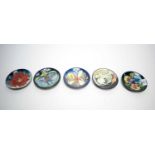 A collection of Moorcroft circular pin dishes