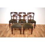 A set of five 19th Century mahogany balloon back dining chairs