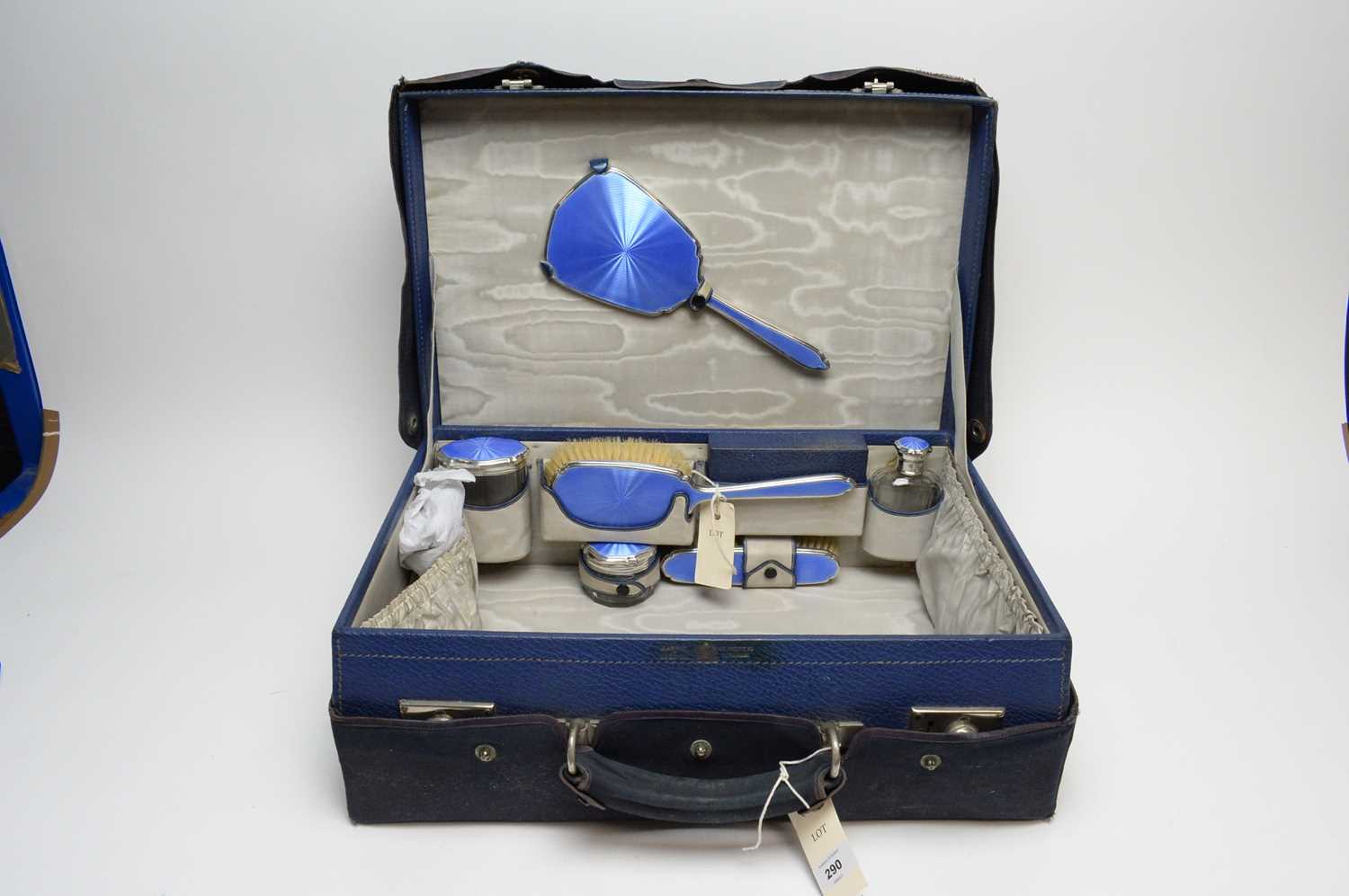 A Mappin & Webb Art Deco silver and enamel dressing table set.
