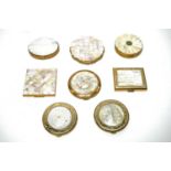 A collection of 1950s mother-of-pearl powder compacts