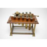 A vintage mahogany and brass xylophone
