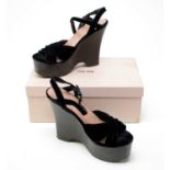 A pair of Miu Miu black velvet wedges