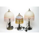 A pair of Art Deco style table lamps; and another lamp
