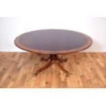 A fine quality 20th Century mahogany and banded dining table by William Tillman
