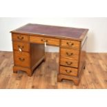 A 20th Century mahogany pedestal writing desk